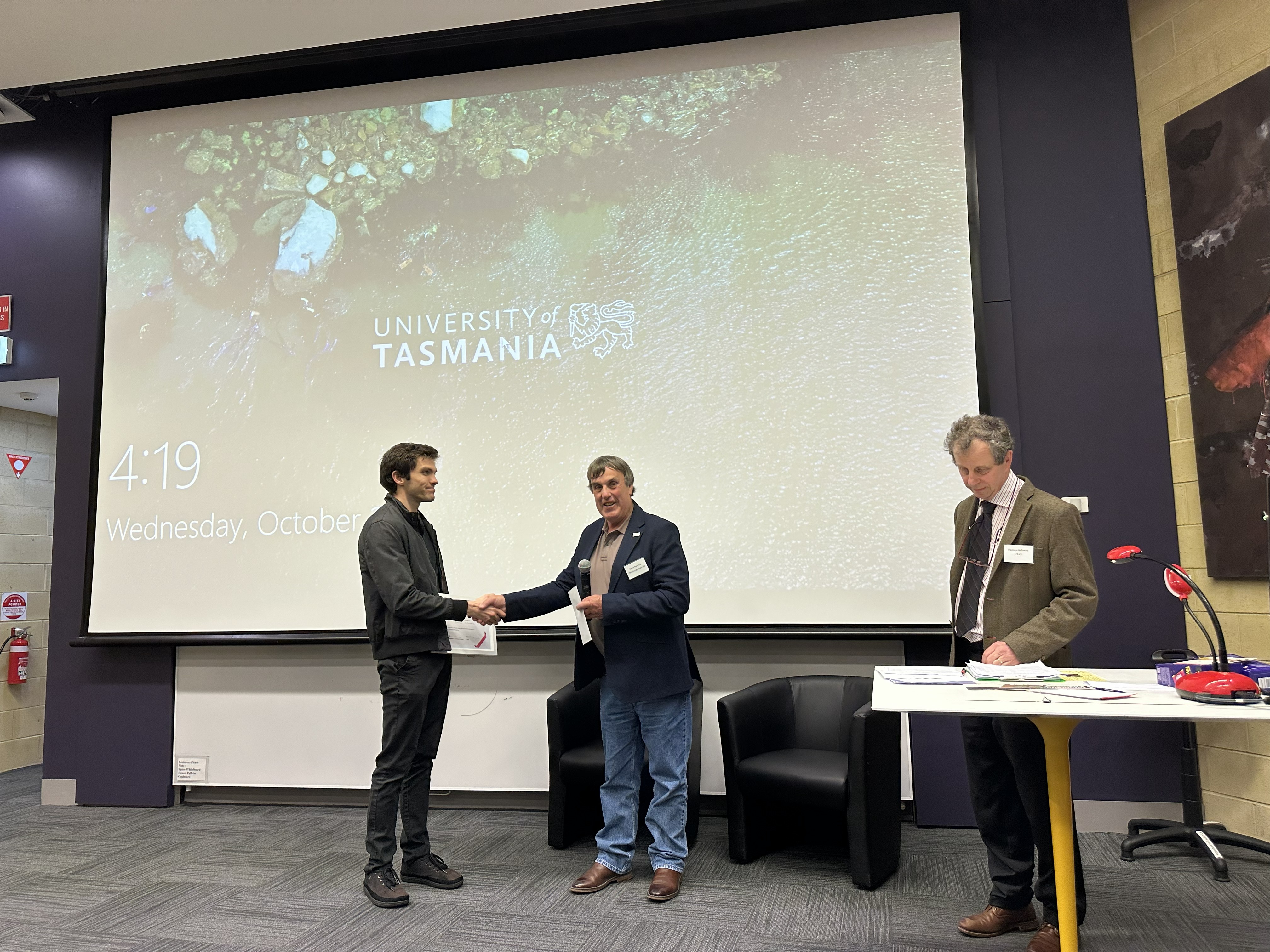 David Barwick congratulates a student winner at the UTAS Open Day